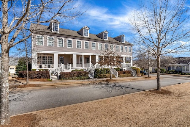 view of front of house with covered porch and stairs