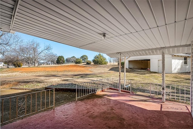 view of patio / terrace featuring a pole building and an outdoor structure