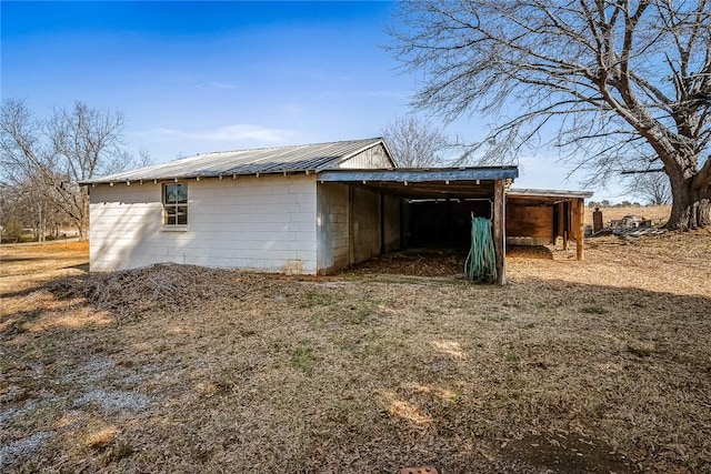 view of outbuilding featuring a carport