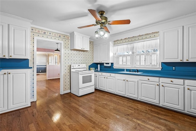 kitchen featuring white range with electric stovetop, crown molding, white cabinetry, a sink, and wallpapered walls