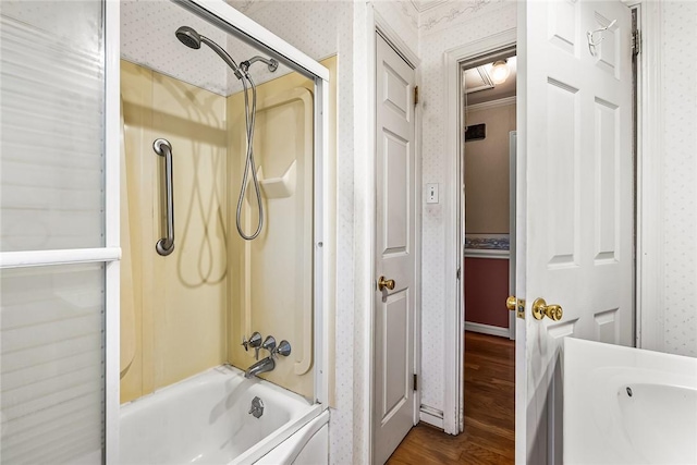 full bath featuring enclosed tub / shower combo, wood finished floors, and wallpapered walls