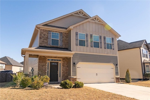 craftsman inspired home with concrete driveway, board and batten siding, and an attached garage