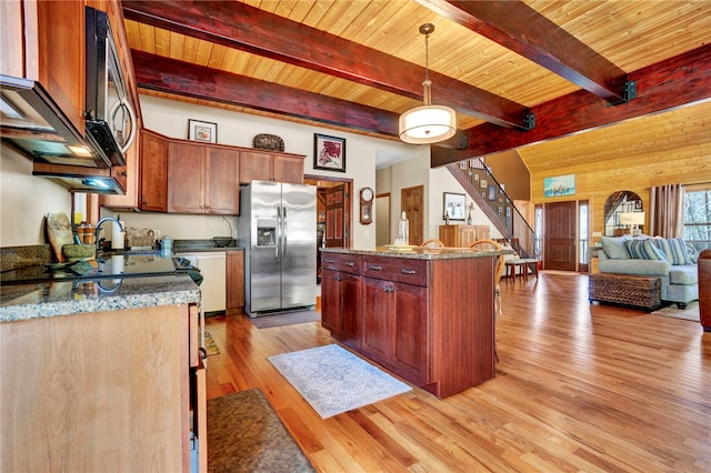 kitchen featuring wood ceiling, light wood-style flooring, decorative light fixtures, and stainless steel fridge with ice dispenser