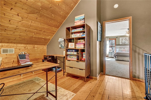 office space featuring lofted ceiling, wooden ceiling, light wood-style flooring, visible vents, and baseboards