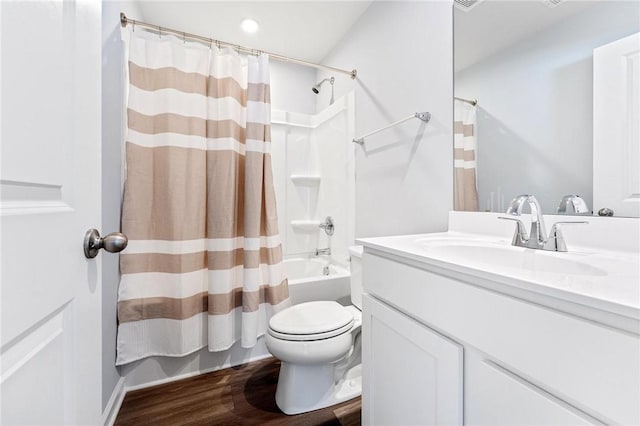 full bath with vanity, wood finished floors, toilet, and shower / tub combo with curtain