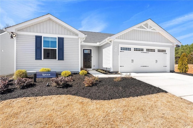 ranch-style house with a garage and driveway