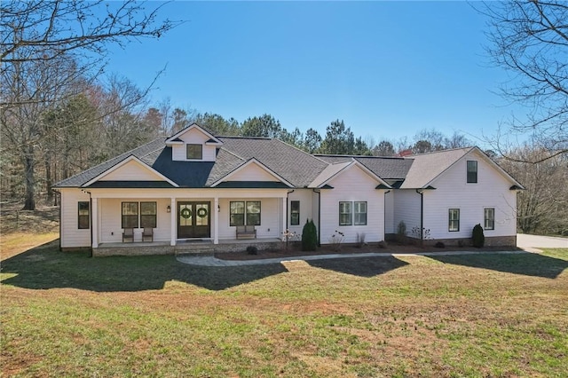 view of front of home with a front lawn and a porch