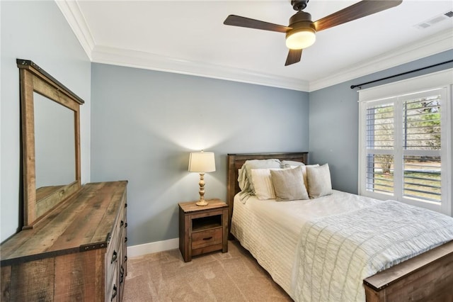 bedroom featuring light colored carpet, a ceiling fan, baseboards, visible vents, and crown molding