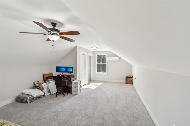 office area with lofted ceiling, baseboards, and carpet flooring