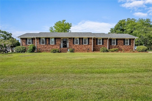 ranch-style house featuring brick siding, crawl space, and a front yard