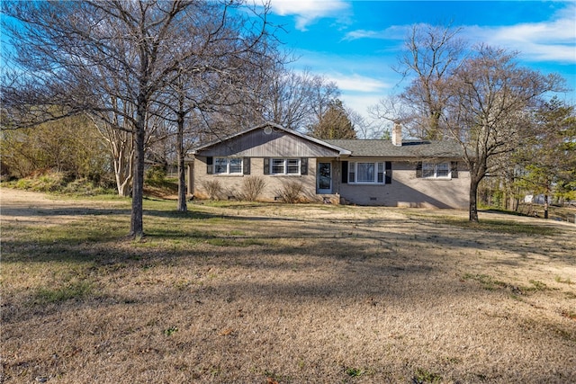 ranch-style house with a front yard, crawl space, brick siding, and a chimney