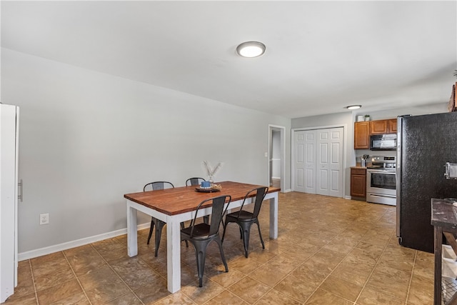 dining space featuring baseboards