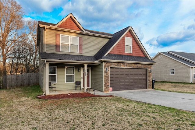 view of front of house featuring a front lawn, covered porch, fence, and concrete driveway