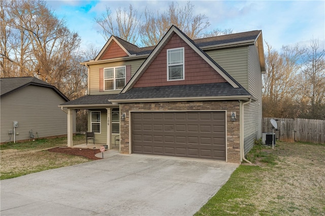 view of front of property with stone siding, central AC unit, concrete driveway, and fence