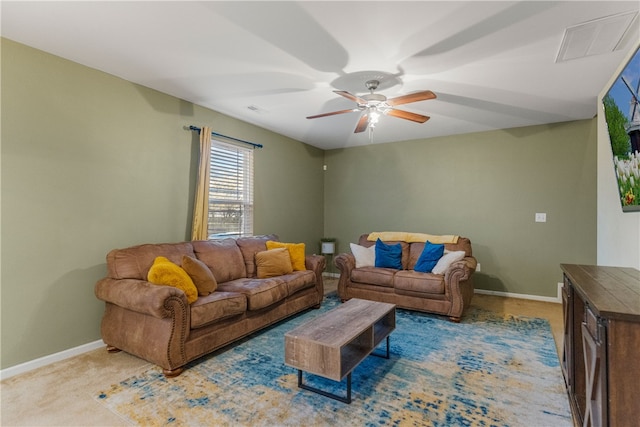 carpeted living area with a ceiling fan, visible vents, and baseboards