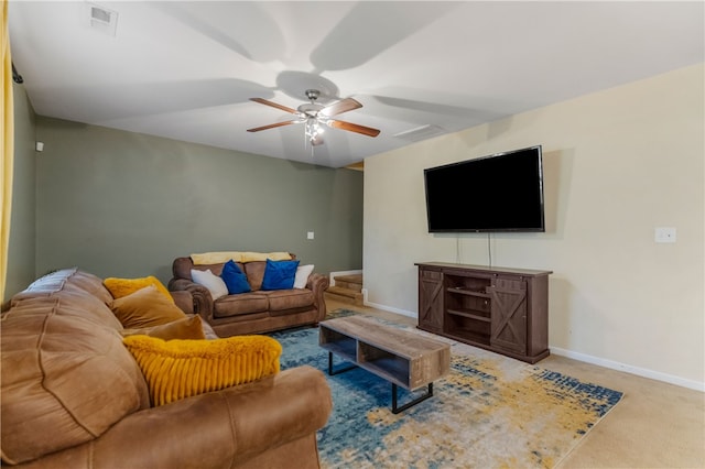 living room featuring ceiling fan, carpet flooring, visible vents, and baseboards