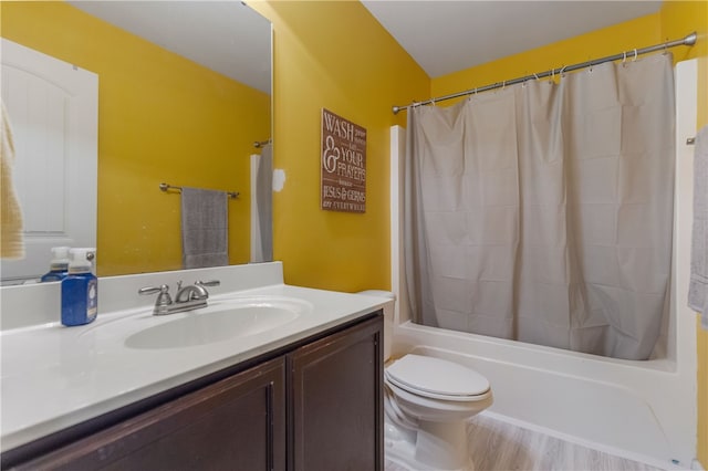 full bath with toilet, wood finished floors, vanity, and shower / bathtub combination with curtain