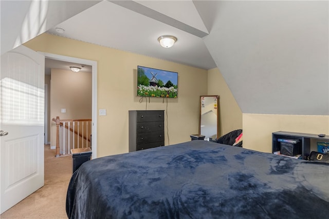 bedroom featuring carpet and lofted ceiling