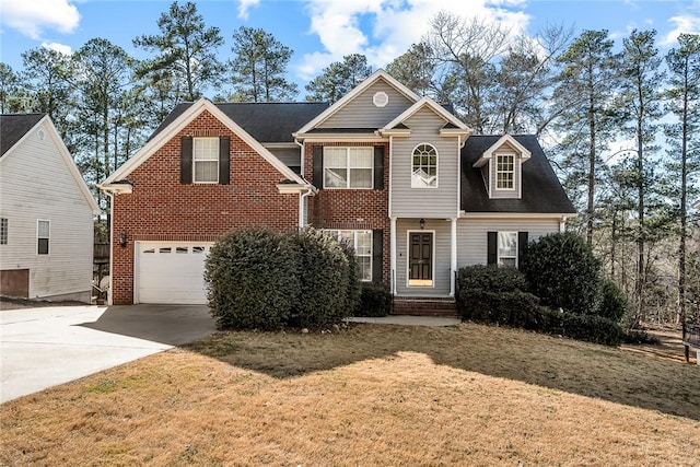 view of front of house featuring a garage, concrete driveway, brick siding, and a front yard