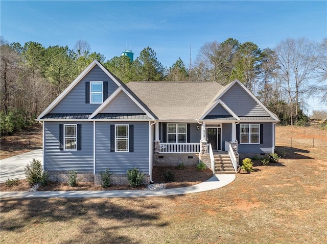 craftsman-style house featuring a porch, crawl space, a standing seam roof, metal roof, and a front lawn