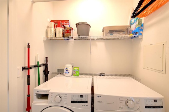 laundry area with laundry area and washing machine and clothes dryer