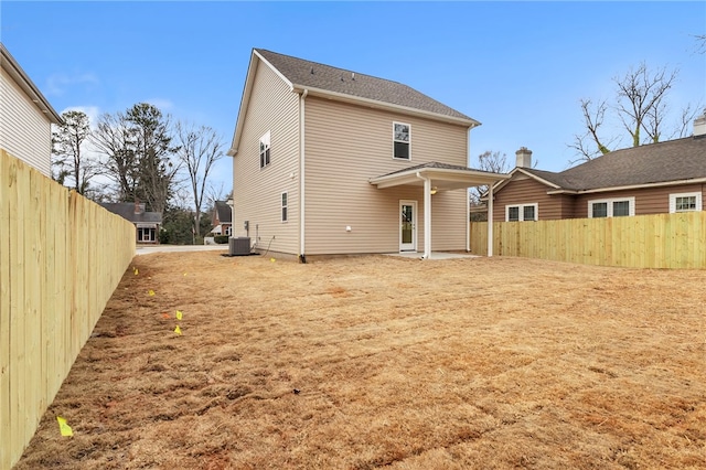 back of house with fence and cooling unit