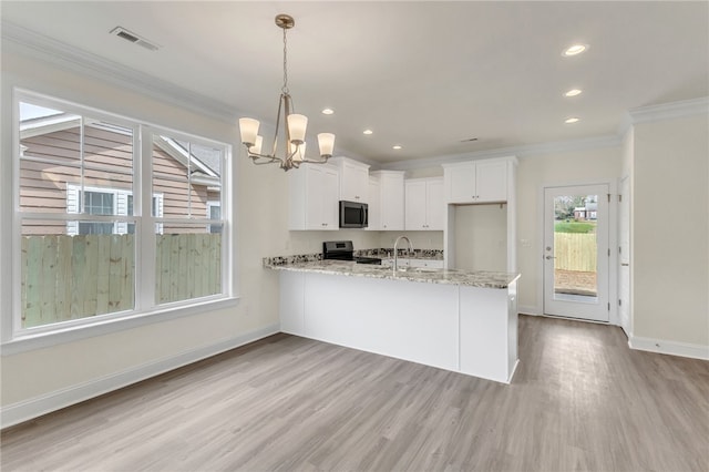 kitchen with stainless steel appliances, a peninsula, white cabinetry, visible vents, and crown molding