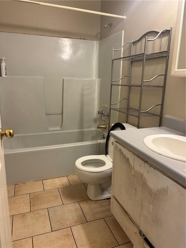 bathroom featuring  shower combination, tile patterned flooring, vanity, and toilet