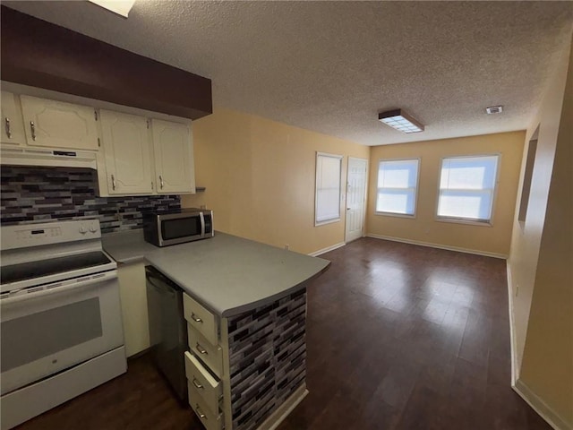 kitchen with under cabinet range hood, a peninsula, white cabinetry, open floor plan, and appliances with stainless steel finishes