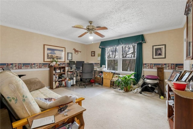 office space with ceiling fan, carpet floors, a textured ceiling, and crown molding