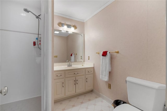 bathroom with baseboards, tiled shower, toilet, crown molding, and vanity