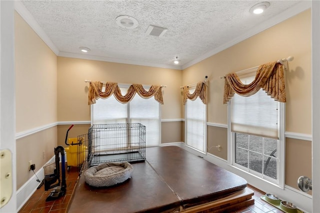 office space featuring crown molding, a textured ceiling, and baseboards