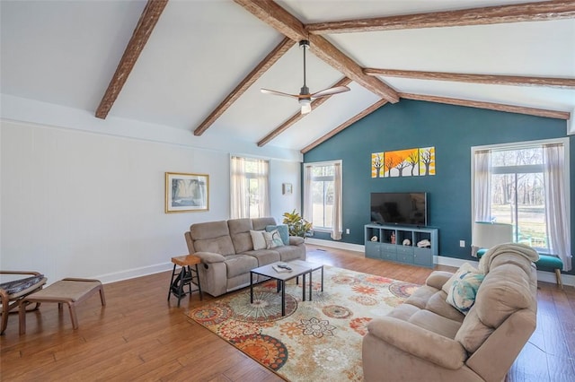 living room with wood-type flooring, vaulted ceiling with beams, baseboards, and ceiling fan