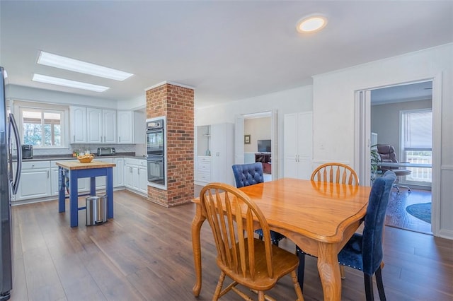 dining area with dark wood-type flooring