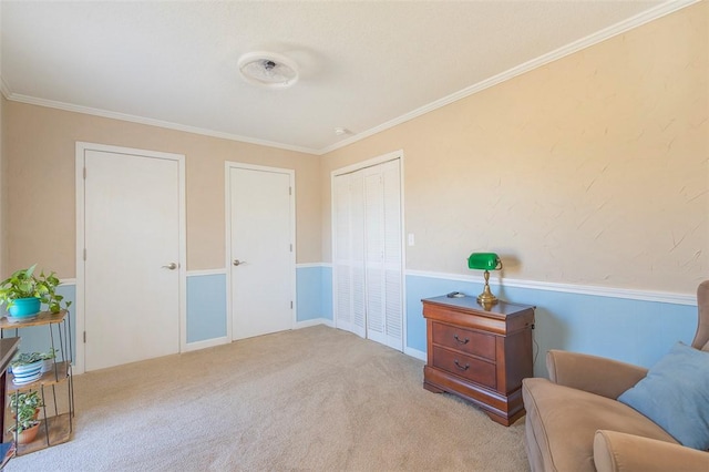 living area featuring ornamental molding and carpet