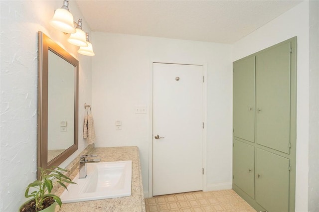 bathroom with vanity and tile patterned floors