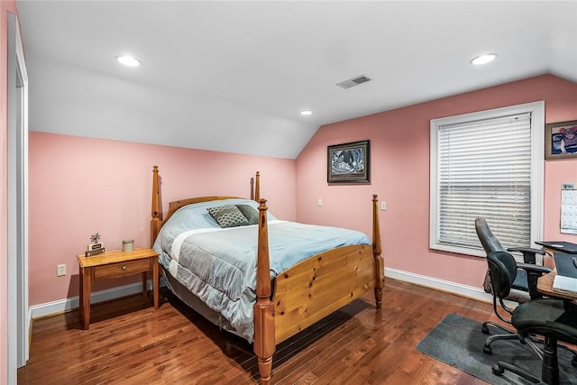 bedroom featuring baseboards, visible vents, lofted ceiling, wood finished floors, and recessed lighting