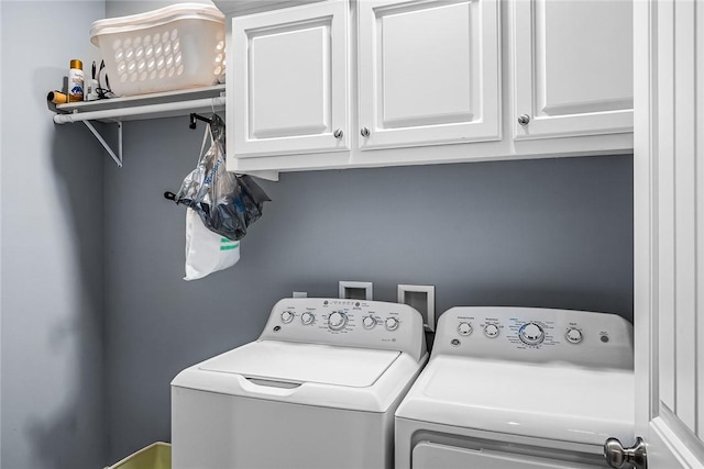 laundry area featuring washer and dryer and cabinet space