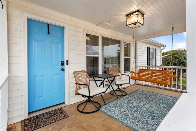 property entrance featuring covered porch