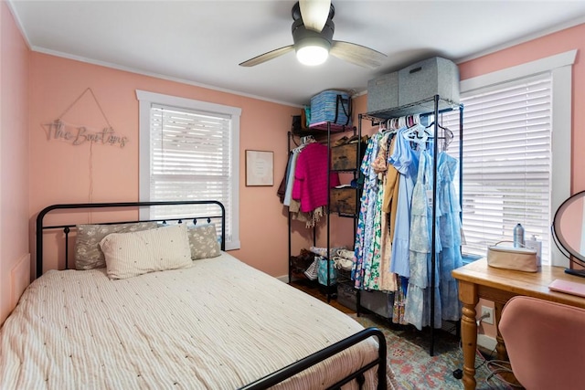 bedroom with multiple windows and a ceiling fan