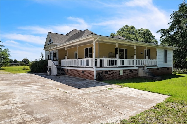 view of front of house with a front lawn, covered porch, and crawl space