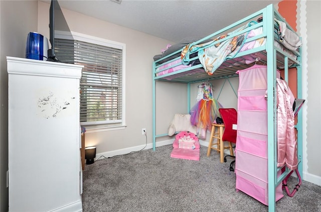 bedroom with carpet, a textured ceiling, and baseboards