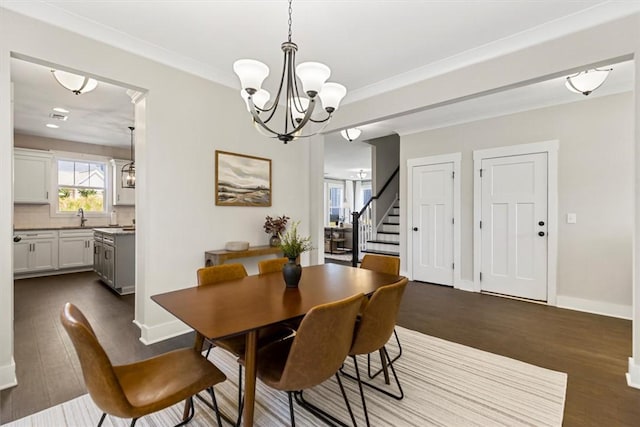 dining area with stairway, crown molding, baseboards, and dark wood-type flooring