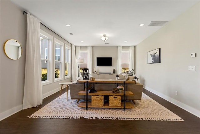 home office with recessed lighting, visible vents, baseboards, and wood finished floors