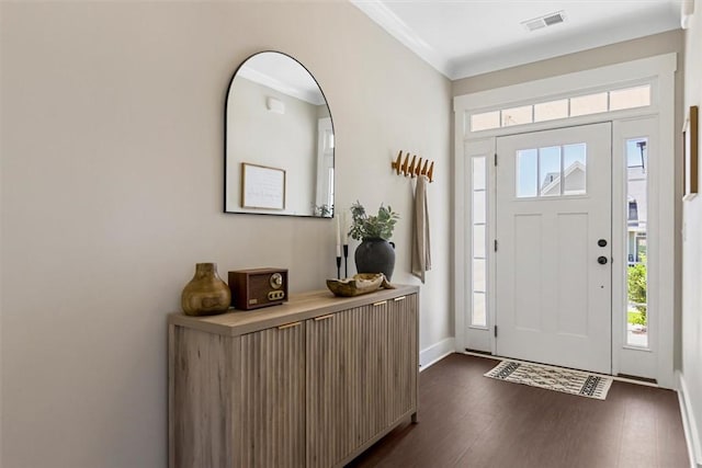 entrance foyer with baseboards, dark wood finished floors, visible vents, and a healthy amount of sunlight