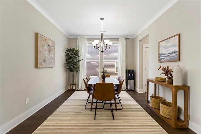 dining space featuring crown molding, dark wood-style flooring, and baseboards