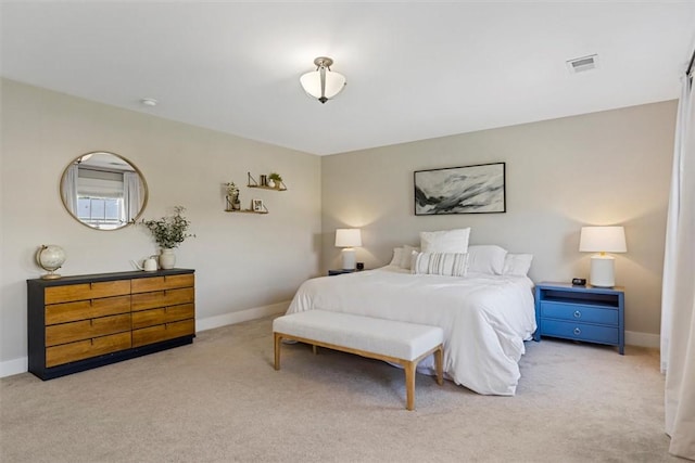 carpeted bedroom featuring visible vents and baseboards