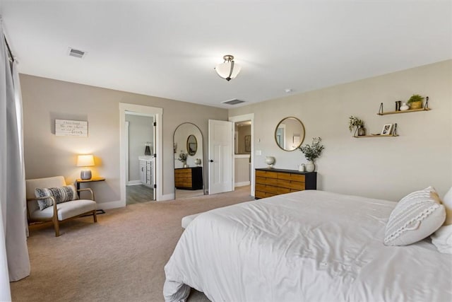 bedroom with light carpet, visible vents, and baseboards