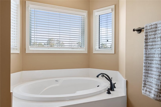 bathroom with a garden tub