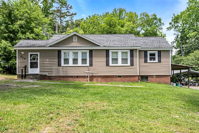 view of front of home with entry steps, a front lawn, and roof with shingles